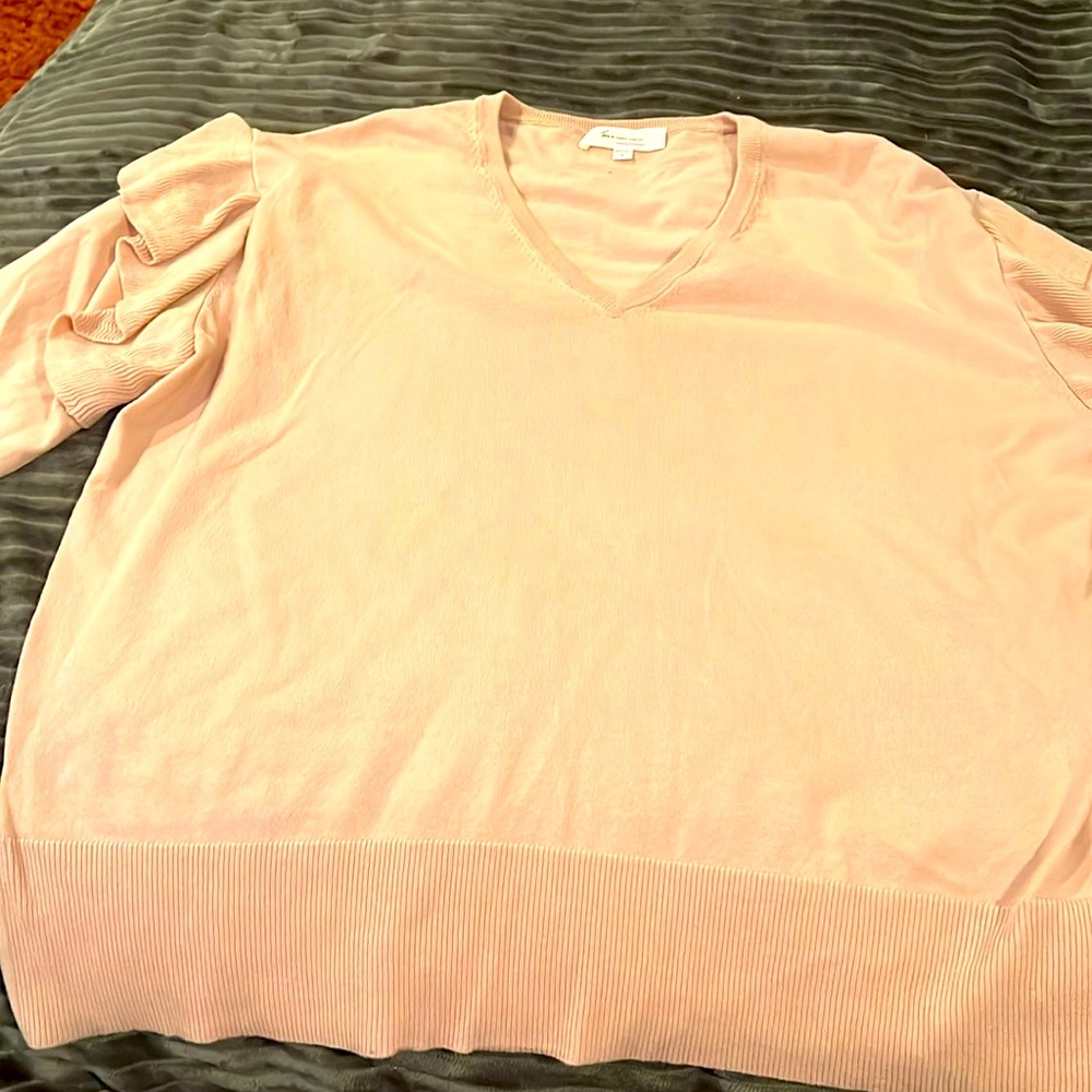 Tan sweater with ruffle at shoulder